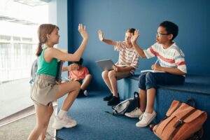 School children hi-fiving